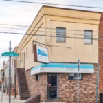 Millie's Ice Cream at the corner of 15th and Shunk Streets in South Philadelphia, a longtime neighborhood gathering place known for giant ice cream cones and generations of family memories.