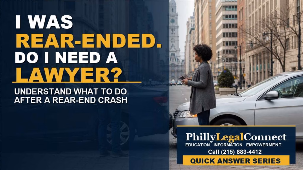 Minor rear-end collision on a Philadelphia street with drivers exchanging information and a passenger seated inside one vehicle.