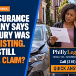 Woman with neck pain reviewing a pre-existing injury claim letter beside a damaged car in Philadelphia.