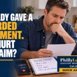 Concerned man reviewing notes beside a phone after he already gave a recorded statement to an insurance company.