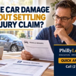 Man reviewing vehicle repair and medical paperwork while considering, “Can I settle my car damage claim without settling my injury claim?”